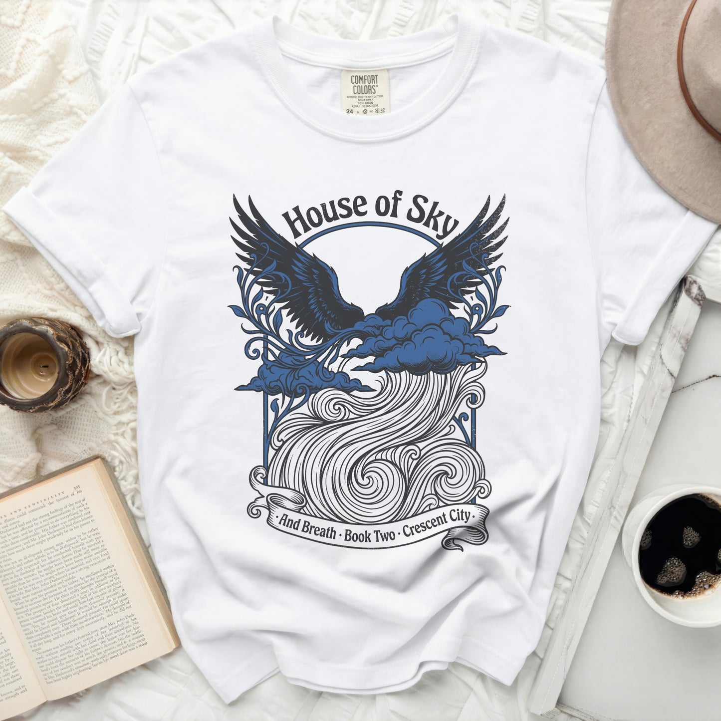 White t-shirt with "House of Sky And Breath Book Two Crescent City" text.