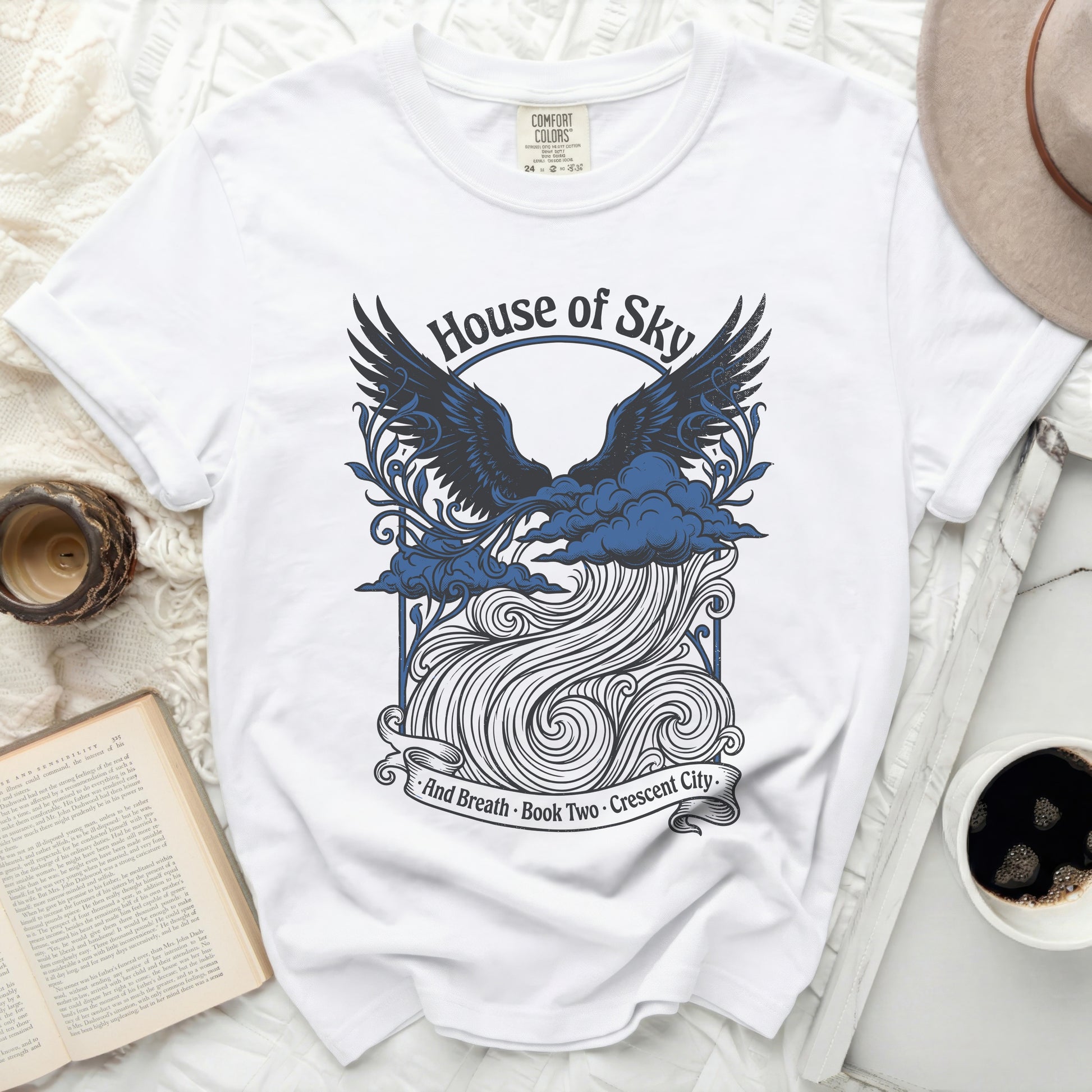 White t-shirt with "House of Sky And Breath Book Two Crescent City" text.