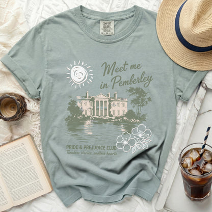 Green t-shirt with "Meet me in Pemberley" and "Pride & Prejudice Club" text.