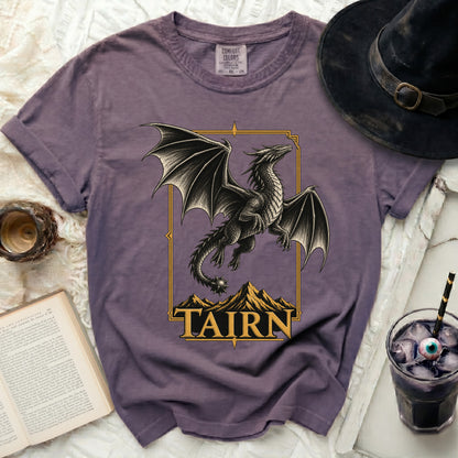 Purple t-shirt with a framed black dragon over mountains and "TAIRN" text.