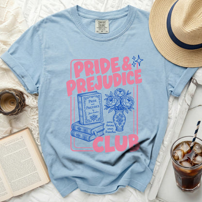 Light blue t-shirt with "Pride & Prejudice" and book graphics.