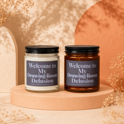 Two candles with "Welcome to My Drawing Room Delusion" text on labels.
