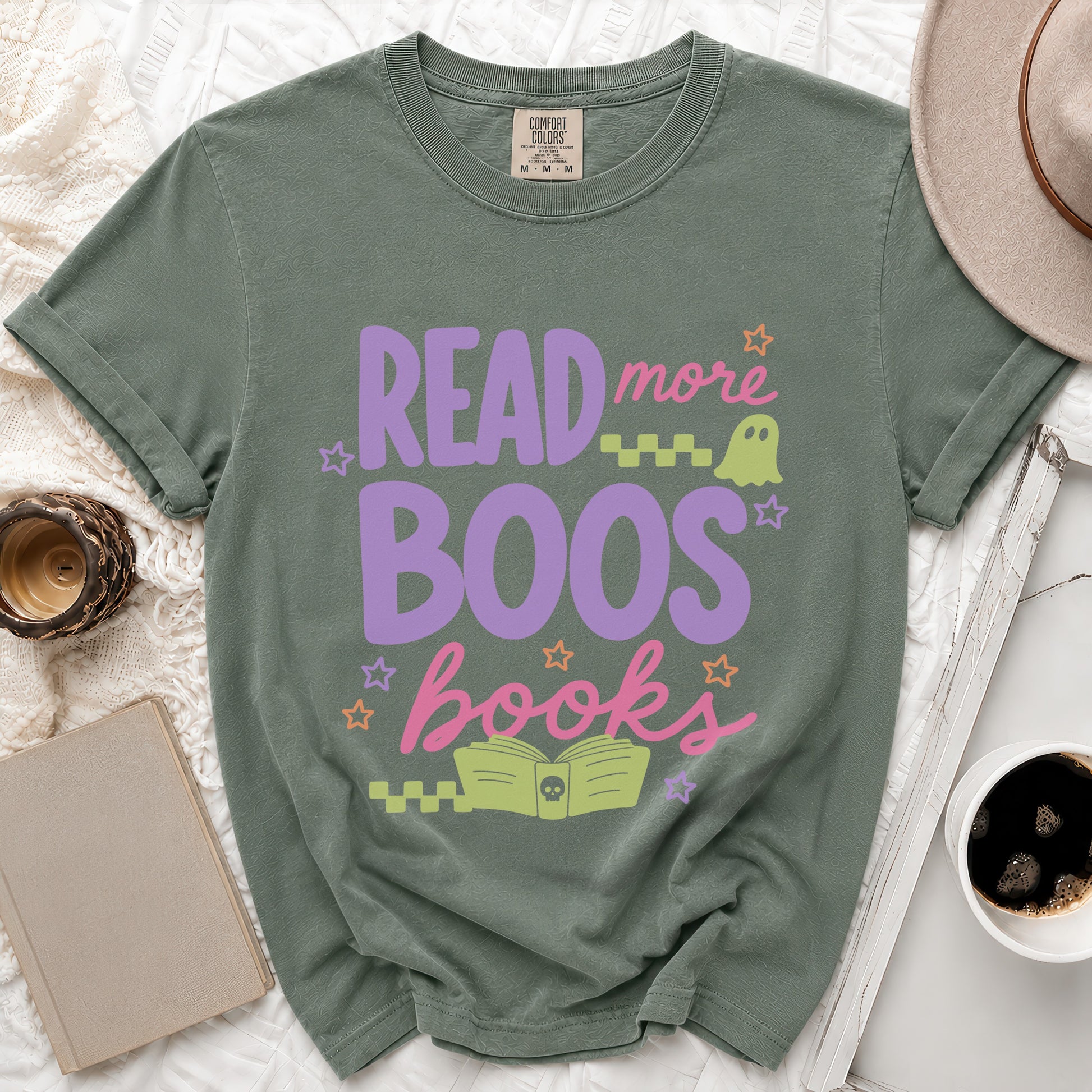 Green t-shirt with "Read more Boos books" graphic and Halloween icons.