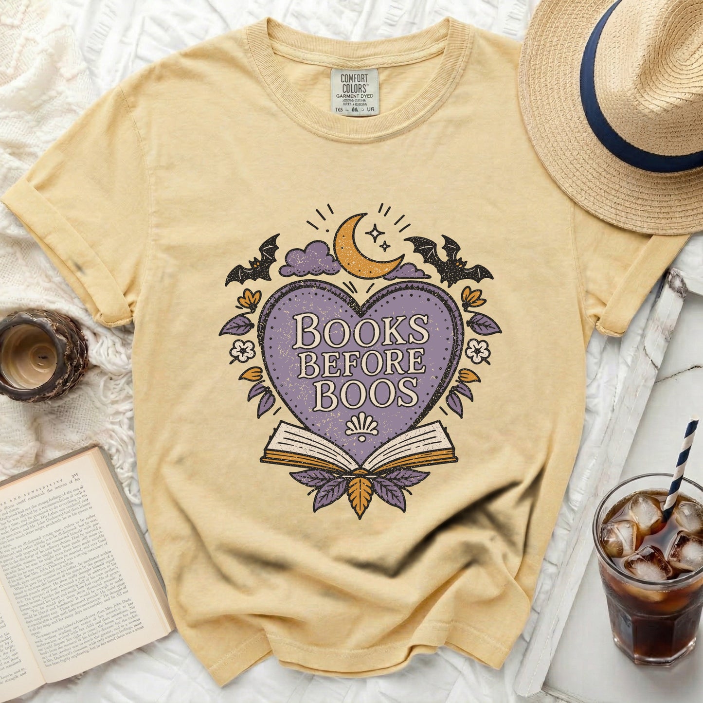 Yellow comfort colors t-shirt with "Books Before Boos" Halloween graphic.