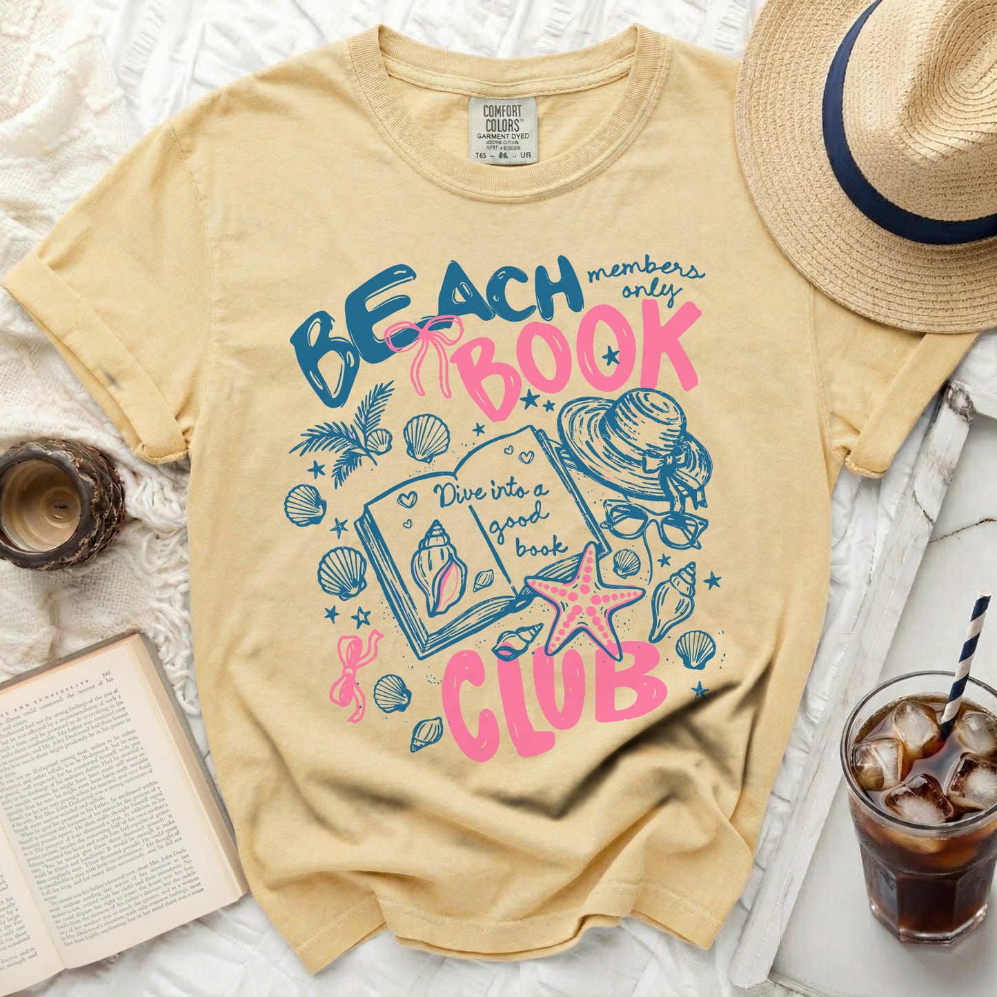 Yellow t-shirt with "Beach members only book club" graphic.