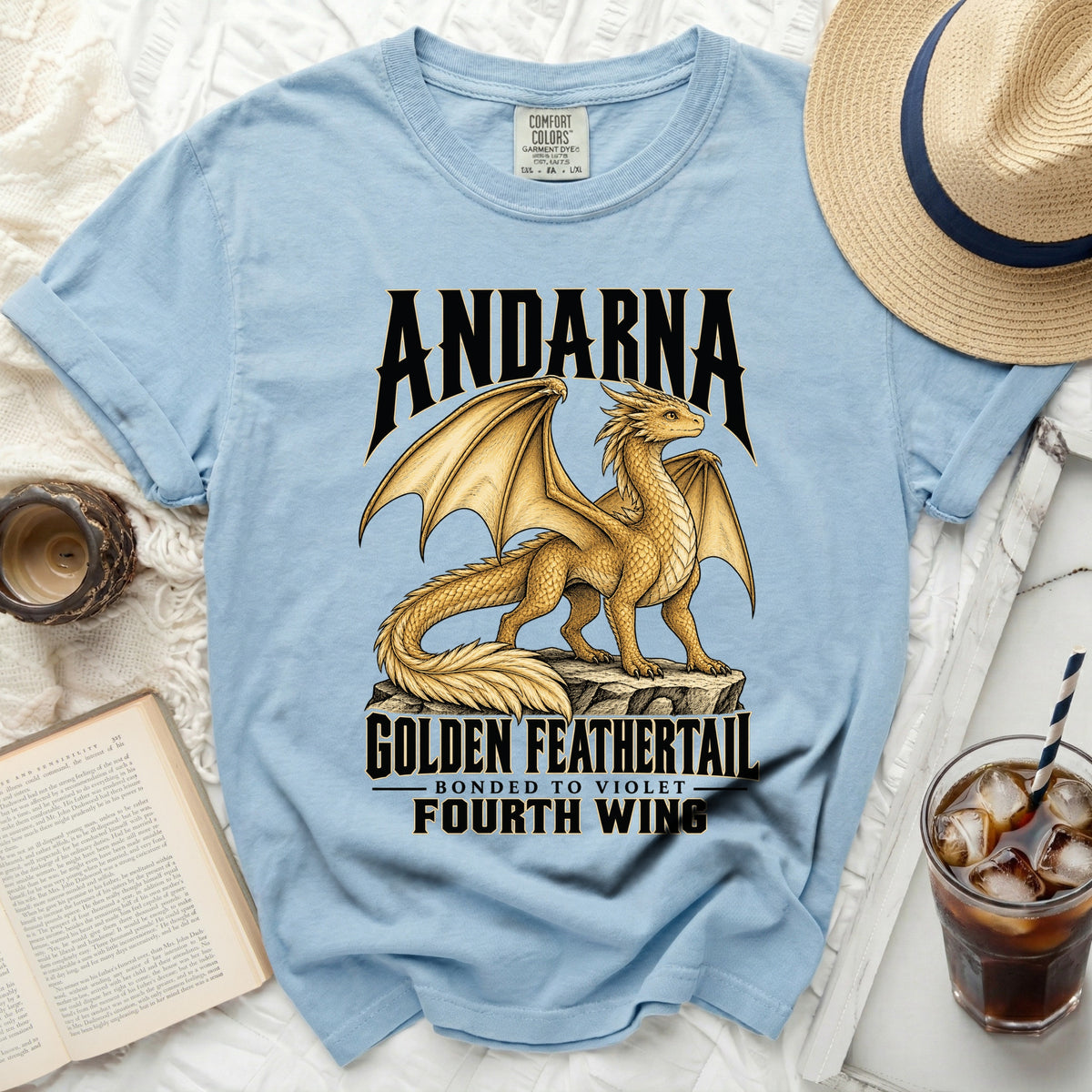 Light blue t-shirt with gold dragon design and text "ANDARNA GOLDEN FEATHERTAIL FOURTH WING".