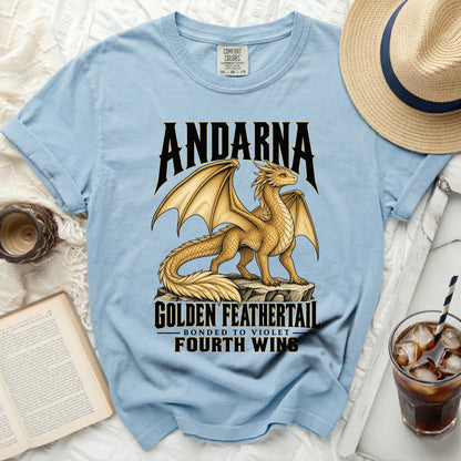 Light blue t-shirt with gold dragon design and text "ANDARNA GOLDEN FEATHERTAIL FOURTH WING".