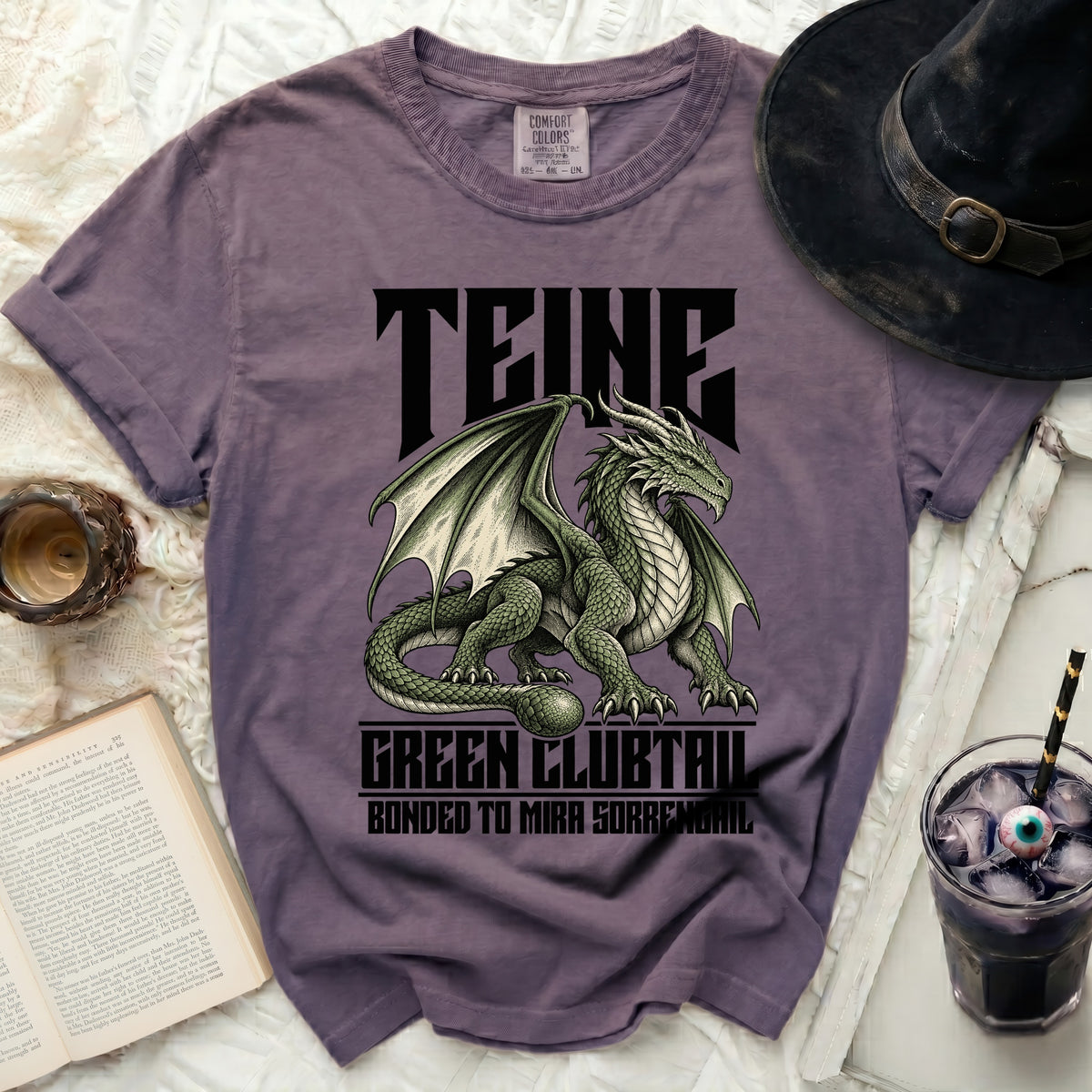 Purple t-shirt with a green dragon graphic and "TEINE, GREEN CLUBTAIL, BONDED TO MIRA SORRENGAIL" text.