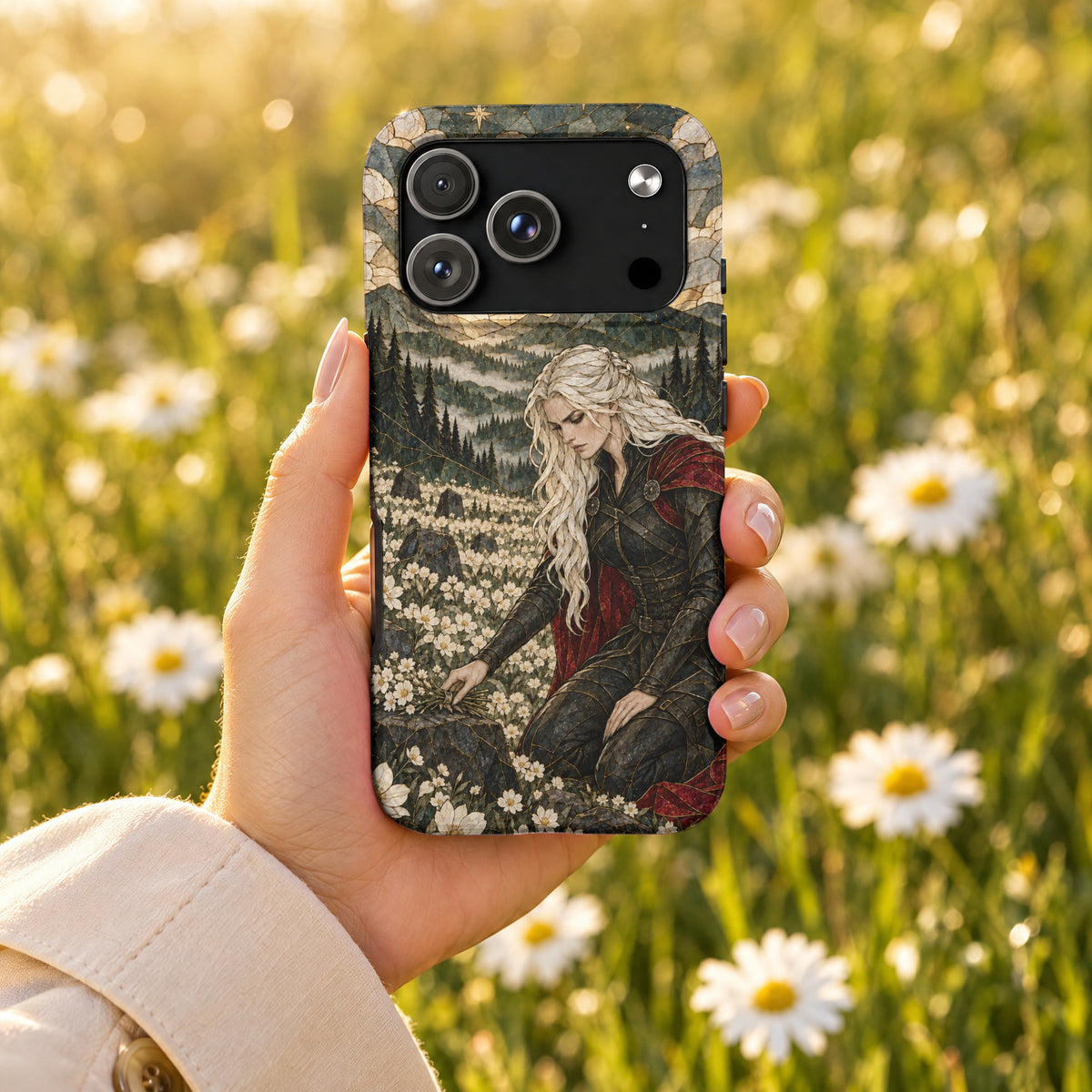 A hand holding a smartphone with a stained-glass fantasy illustration case featuring a female warrior.