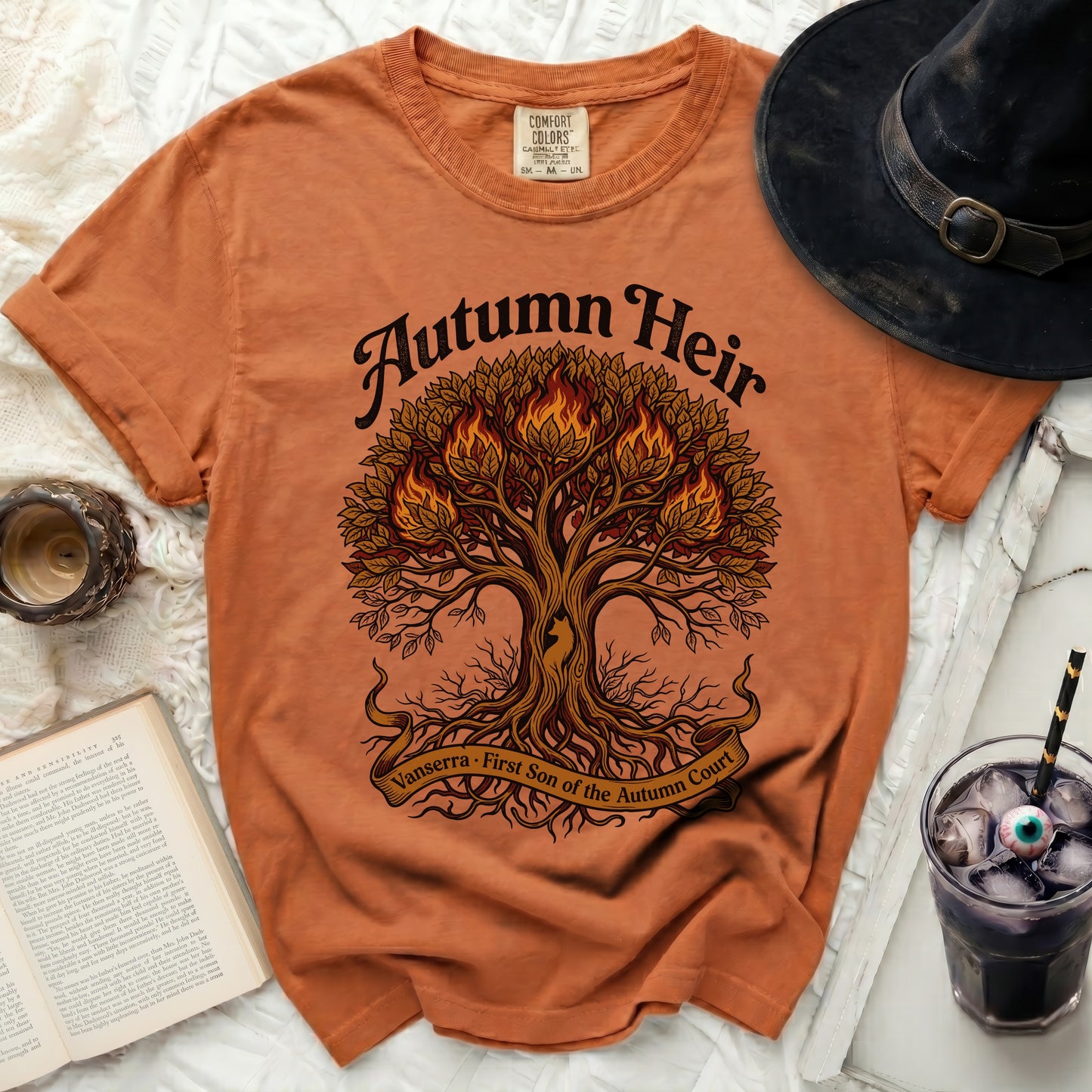Orange t-shirt with a fiery tree graphic and text "Autumn Heir Vanserra First Son of the Autumn Court".