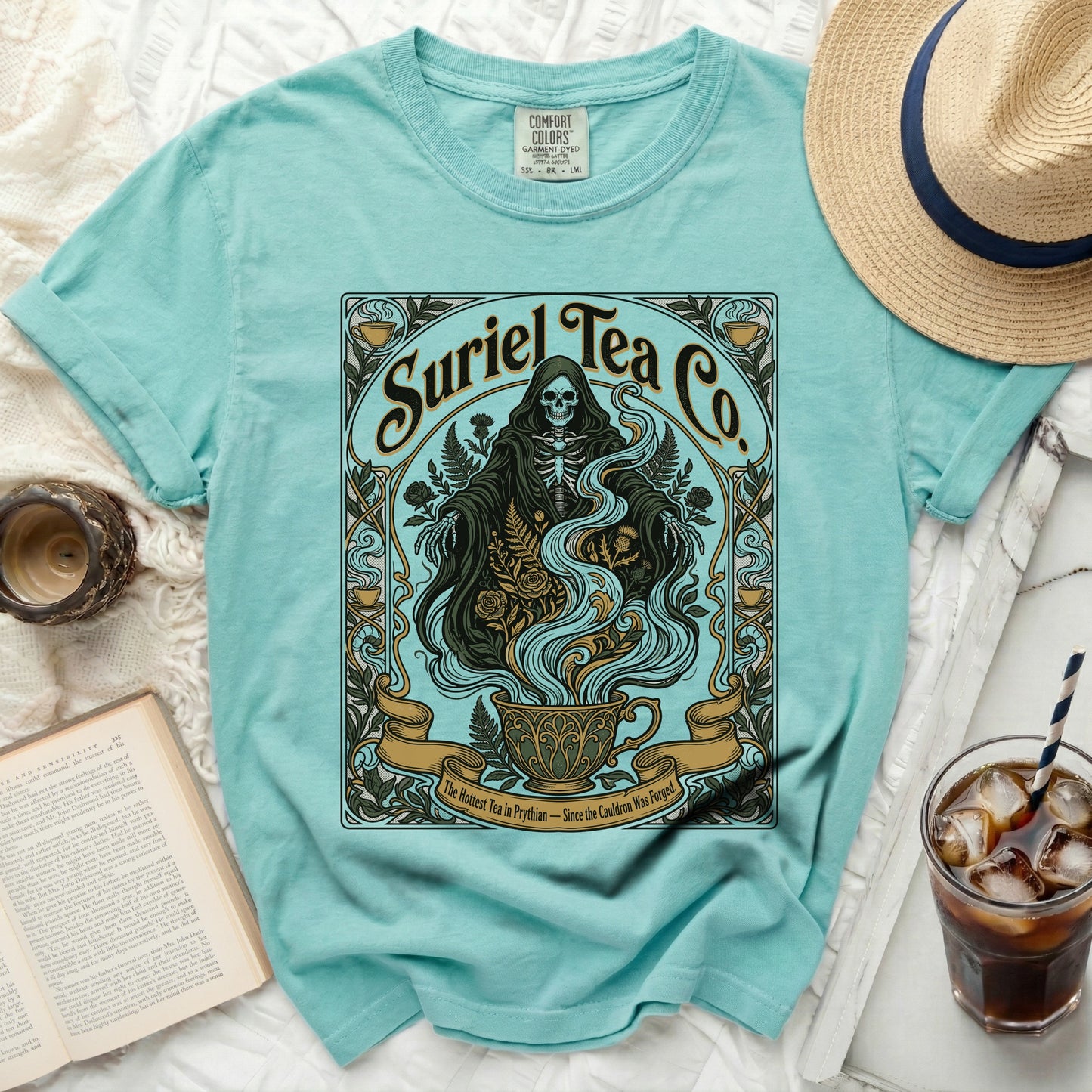 Teal t-shirt with grim reaper and teapot graphic, text "Suriel Tea Co."