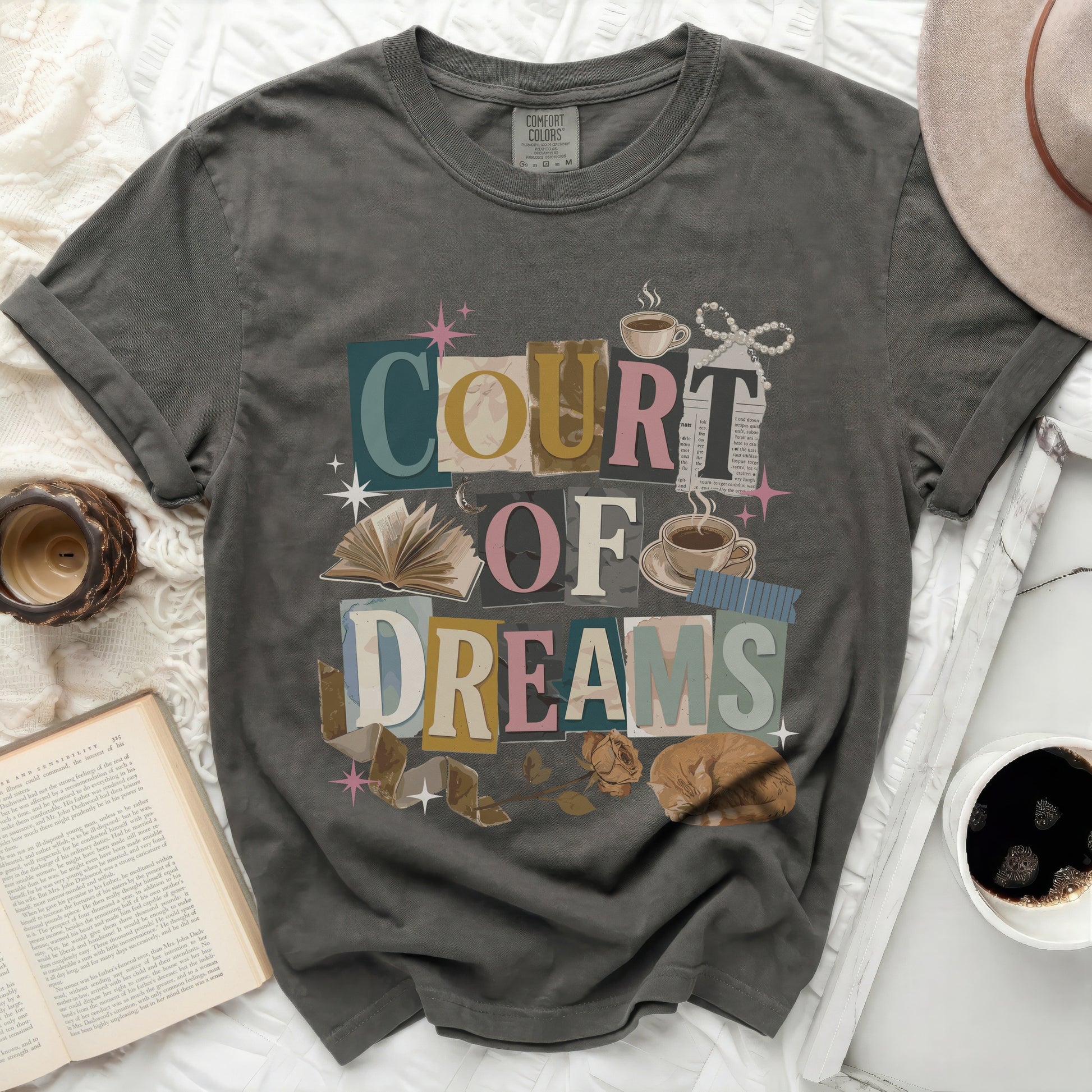 Gray t-shirt with "Court of Dreams" collage design, book, and cat.