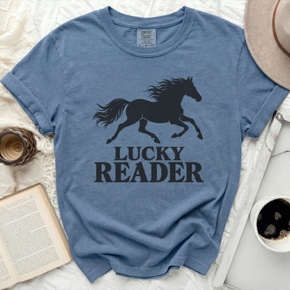 Blue t-shirt with black horse silhouette and "LUCKY READER" text.