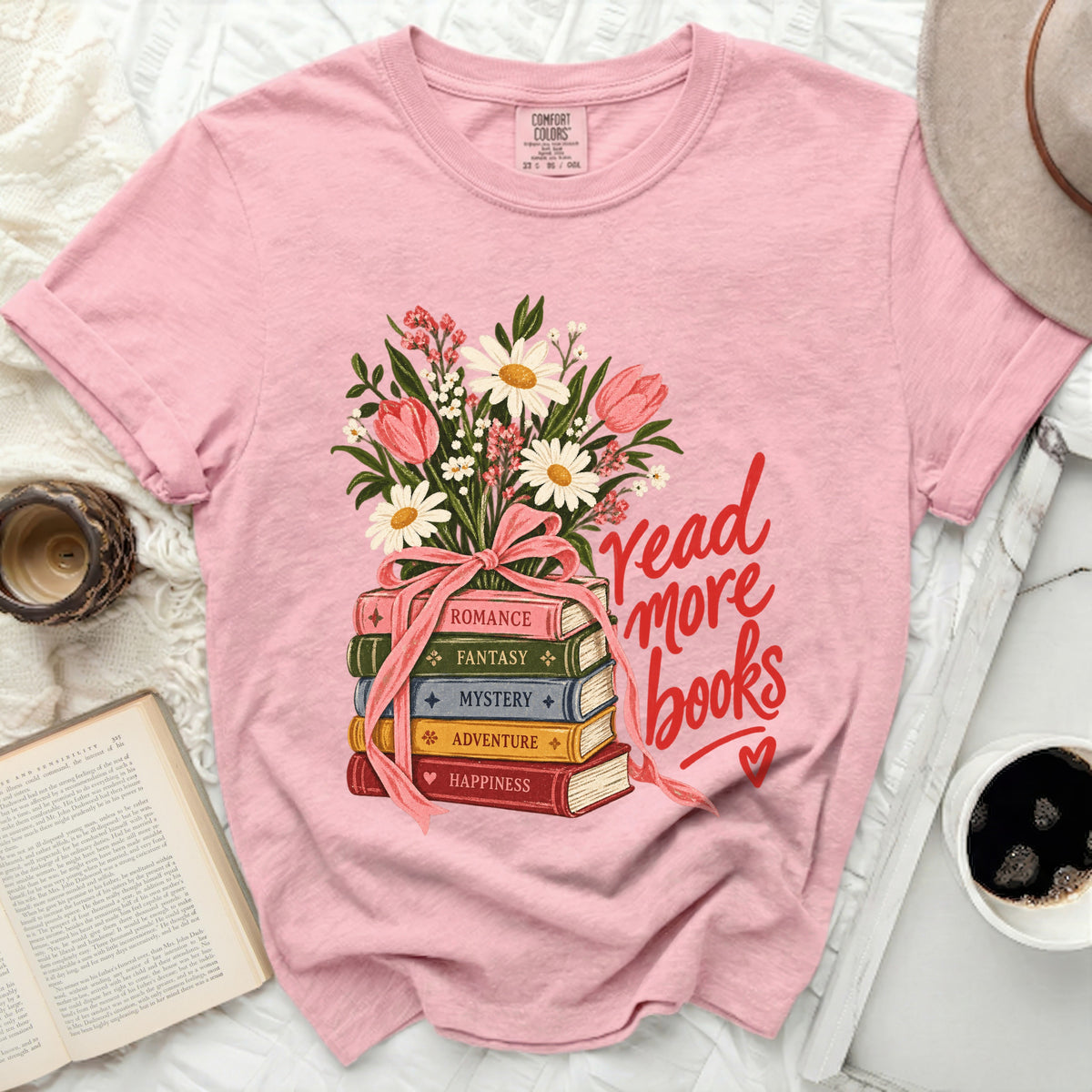 Pink t-shirt with stacked books and "read more books" text.