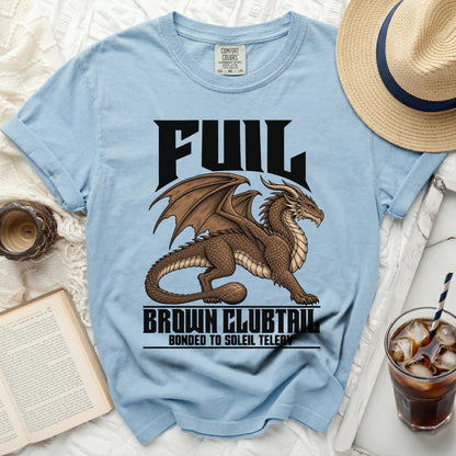 Light blue t-shirt with a brown dragon graphic and text: "FUL", "BROWN CLUBTAIL", "BONDED TO SOLEIL TELERY".