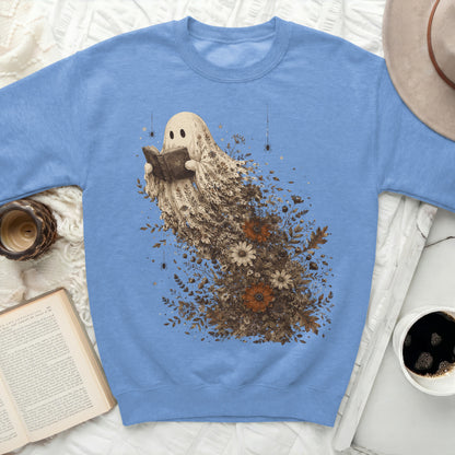 Blue sweatshirt with a ghost reading a book surrounded by floral elements.