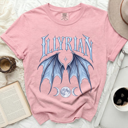 Pink t-shirt with "ILLYRIAN" text, blue bat wings, and triple moons.