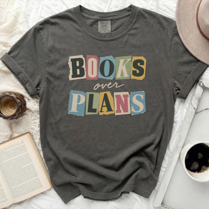 Charcoal grey Comfort Colors t-shirt with "BOOKS over PLANS" graphic.