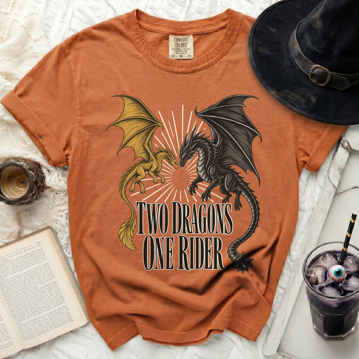 Orange t-shirt with graphic of two dragons and text "TWO DRAGONS ONE RIDER".
