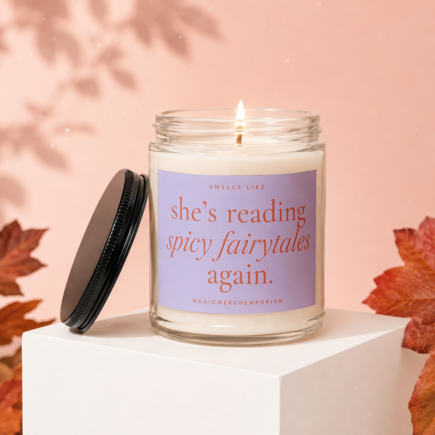 Scented candle with text "she's reading spicy fairytales again."