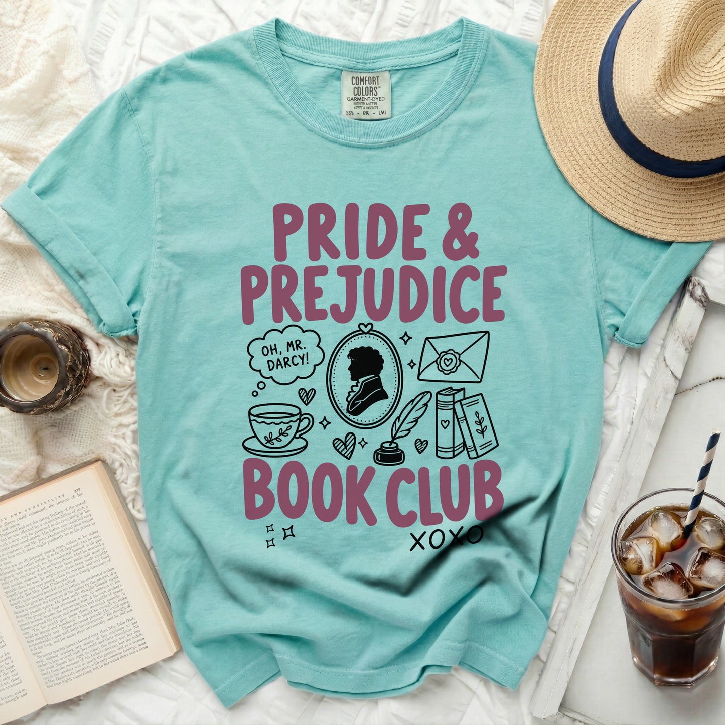 Teal t-shirt with "Pride & Prejudice Book Club" graphic and illustrations.