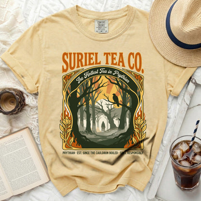 Yellow t-shirt with "Suriel Tea Co." and a forest graphic.