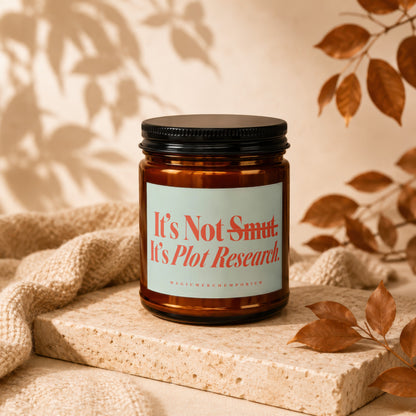 Amber jar candle with "It's Not Smut. It's Plot Research." text.
