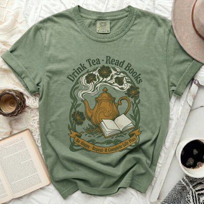 Green t-shirt with teapot, open book, and floral design, text "Drink Tea. Read Books."