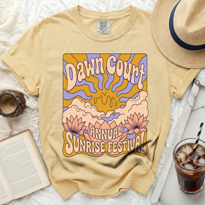Yellow t-shirt with "Dawn Court Annual Sunrise Festival" graphic design.