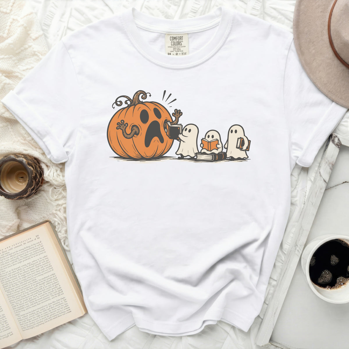 White t-shirt with a Halloween graphic of a surprised pumpkin and reading ghosts.