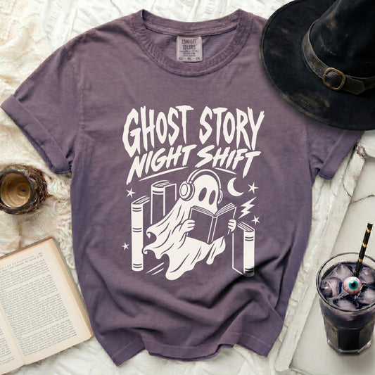 Purple t-shirt with ghost reading books and "Ghost Story Night Shift" text.