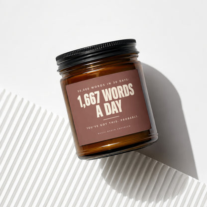 Brown jar with black lid featuring a label that reads "1,667 WORDS A DAY".