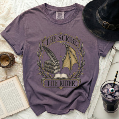 Purple t-shirt with "The Scribe The Rider" text and a circular emblem.