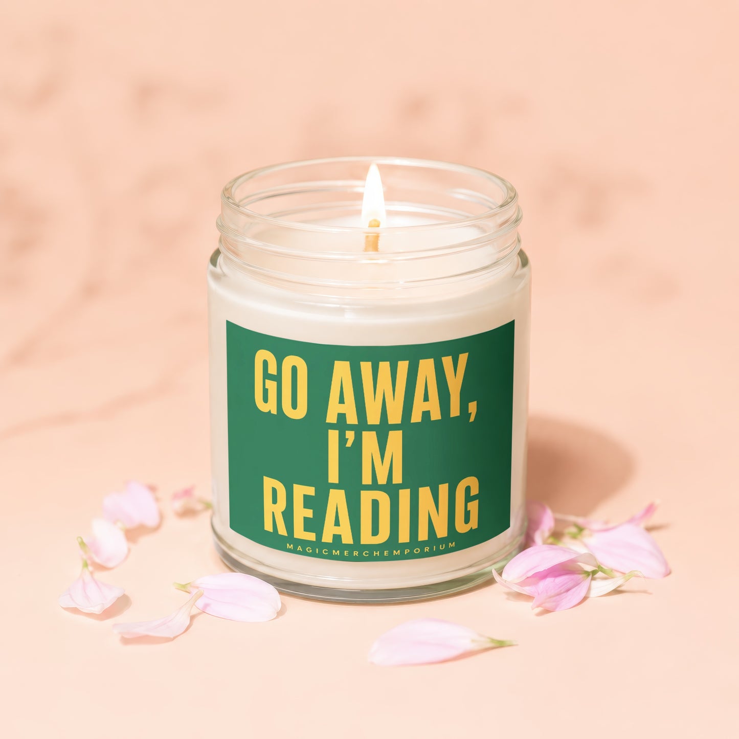 Scented candle in a glass jar with text "GO AWAY, I'M READING".