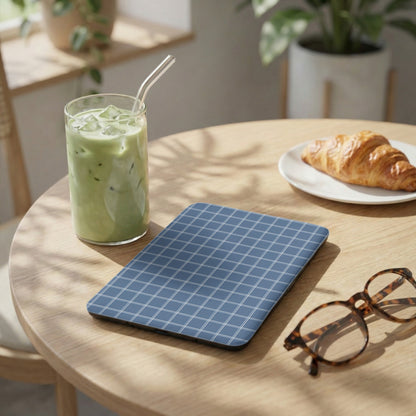Blue and White Checkered Tablet on Wooden Table