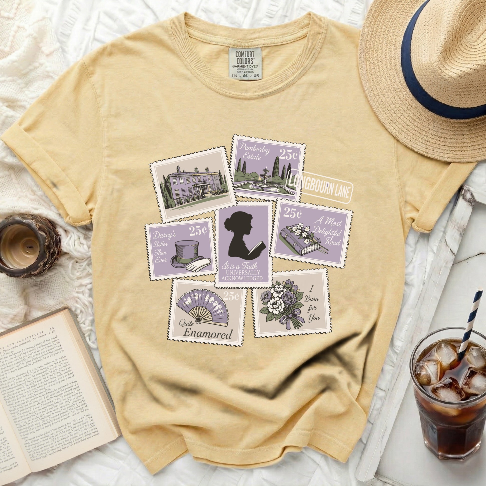 Yellow t-shirt with vintage postage stamp graphics and literary quotes.