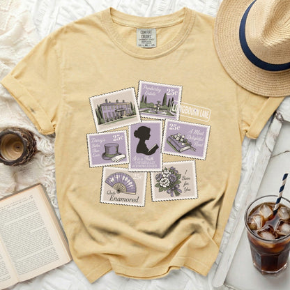 Yellow t-shirt with vintage postage stamp graphics and literary quotes.