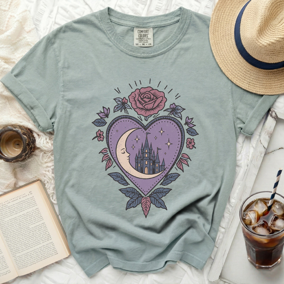T-shirt with a heart design featuring a crescent moon, castle, and rose.