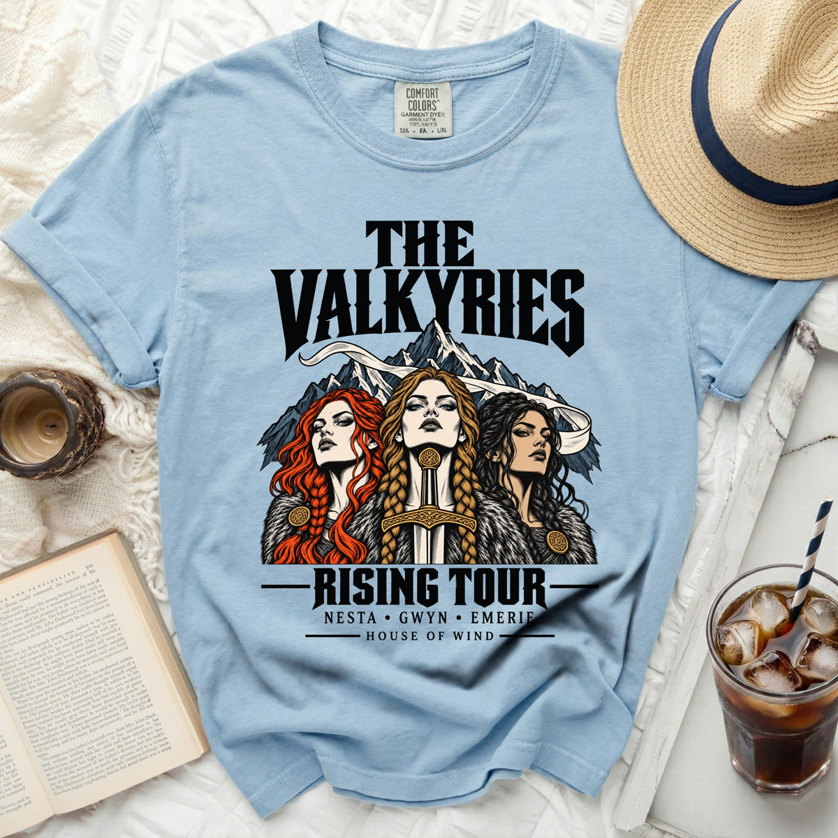 Light blue t-shirt with "The Valkyries Rising Tour" and three women art.