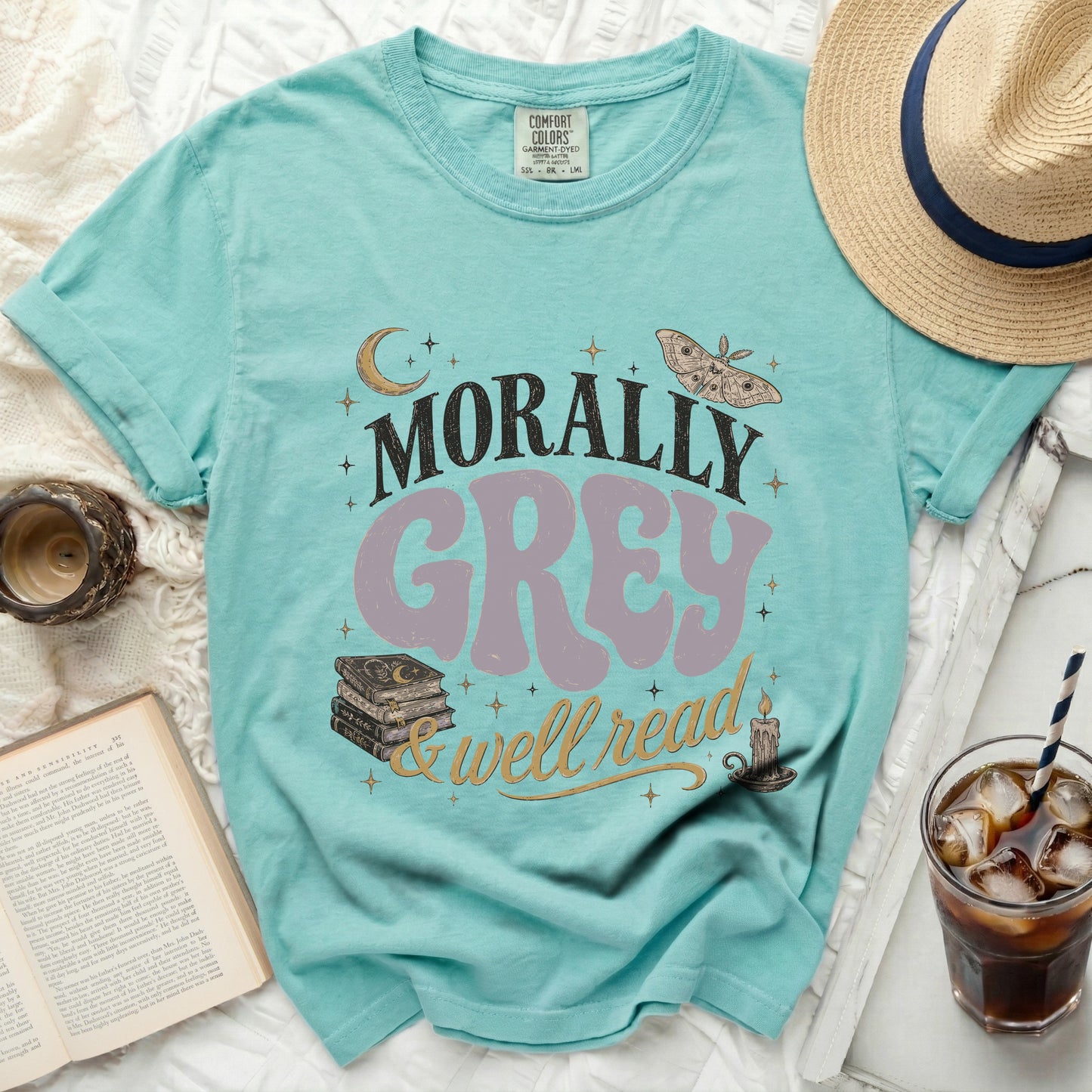 Teal t-shirt with "Morally Grey & well read" text design.