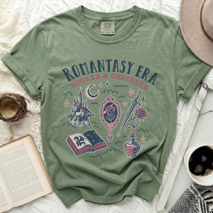 Green t-shirt with "Romantasy Era Booked & Obsessed" design.