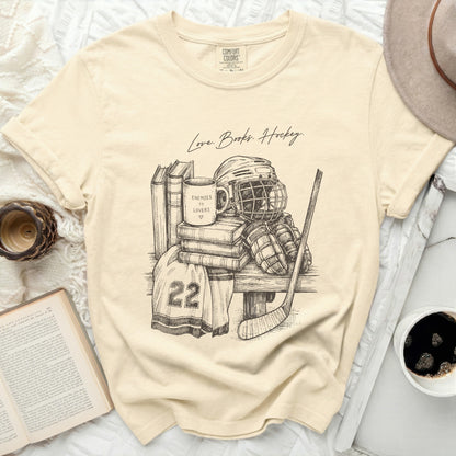 T-shirt with "Love. Books. Hockey." and hockey gear illustration.