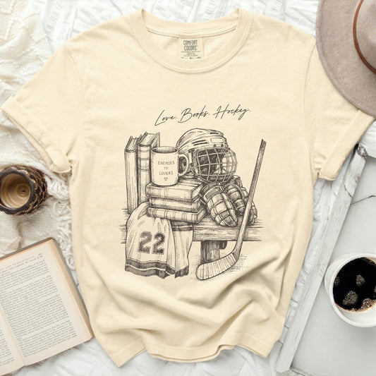 T-shirt with "Love. Books. Hockey." and hockey gear illustration.