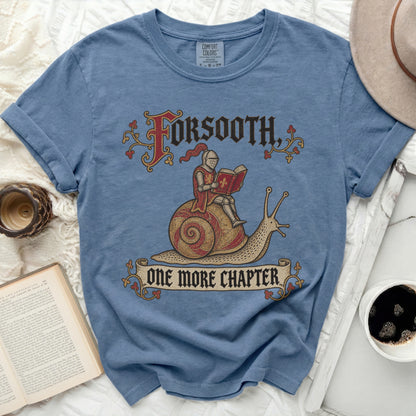 Blue t-shirt with "Forsooth, One More Chapter" text and knight on snail graphic.