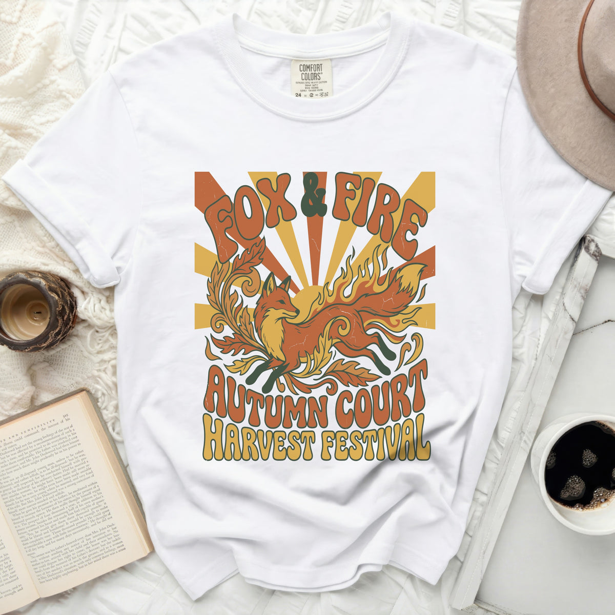 White t-shirt with "Fox & Fire Autumn Court Harvest Festival" graphic.