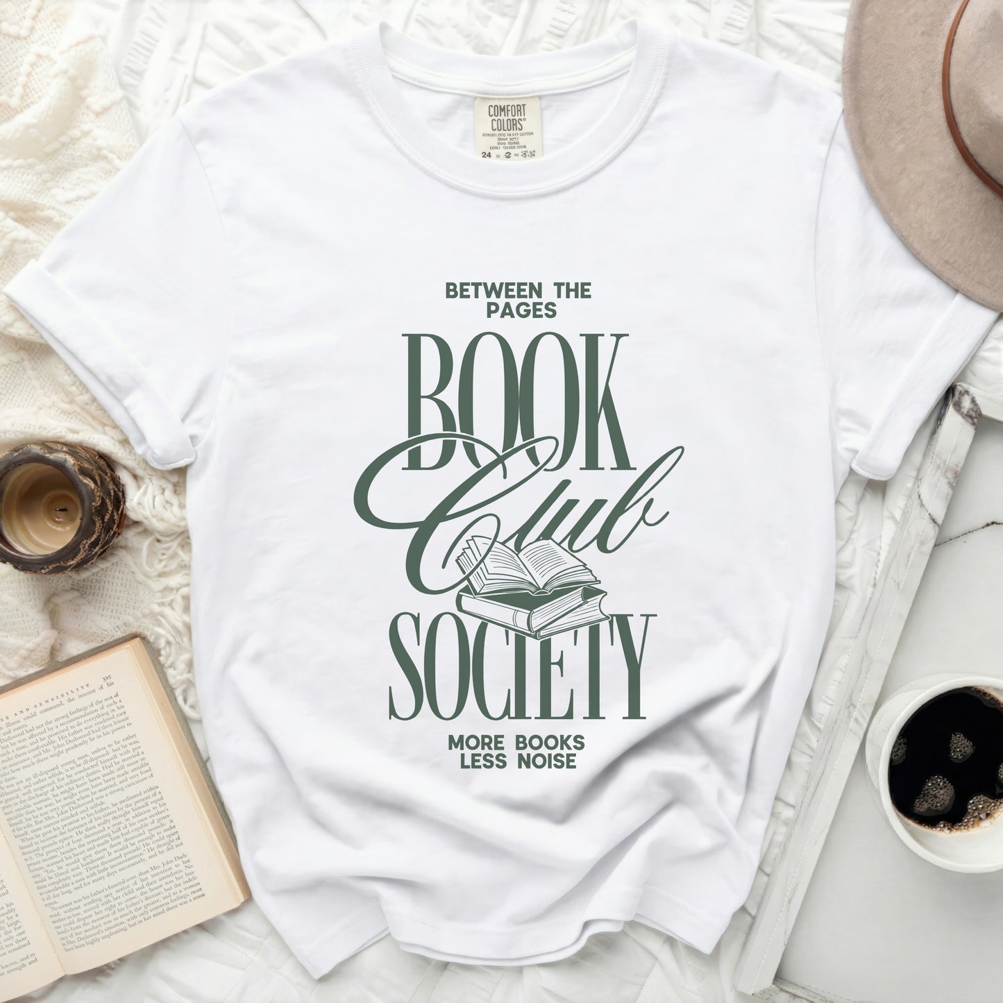 Between the Pages Book Club Society graphic tee with open books.