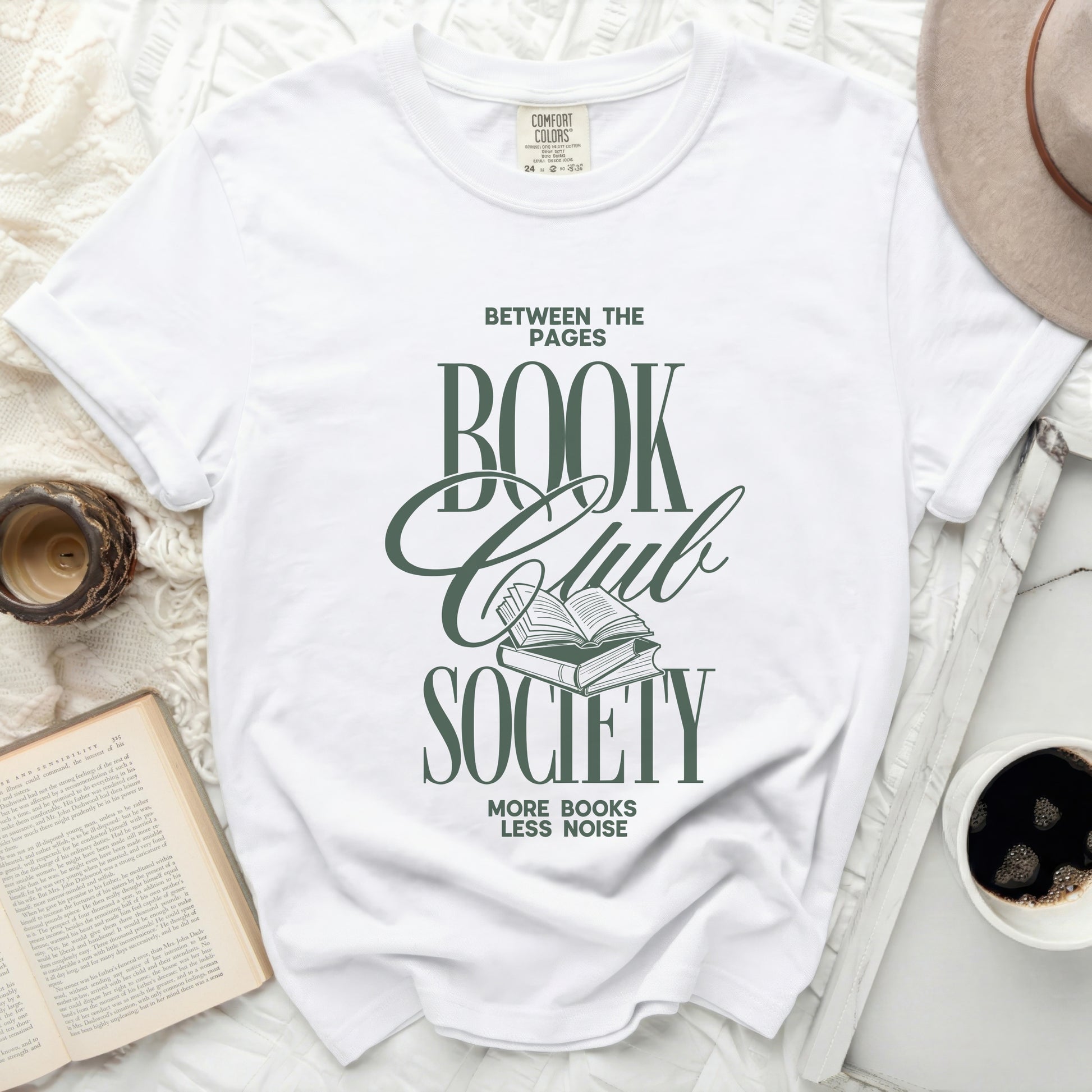 Between the Pages Book Club Society graphic tee with open books.