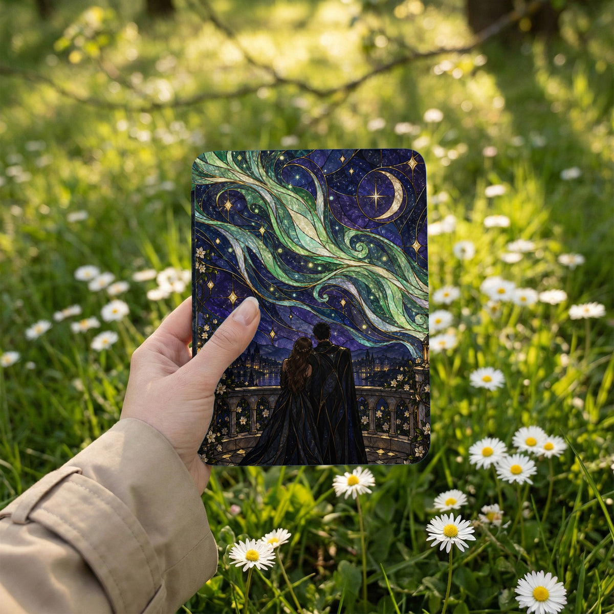 Couple looking at starry night sky with green aurora and crescent moon.