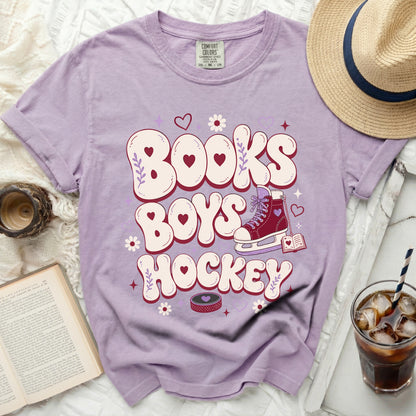 Purple t-shirt with "Books Boys Hockey" text and ice skate graphic.