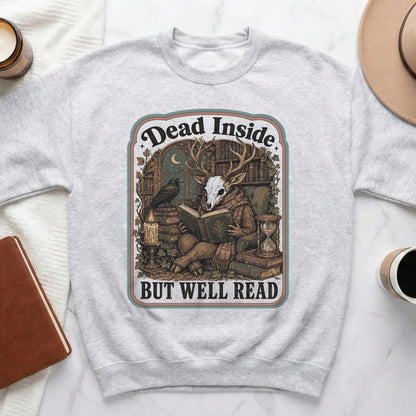 Graphic on light grey sweatshirt: "Dead Inside but Well Read" with skull deer reading